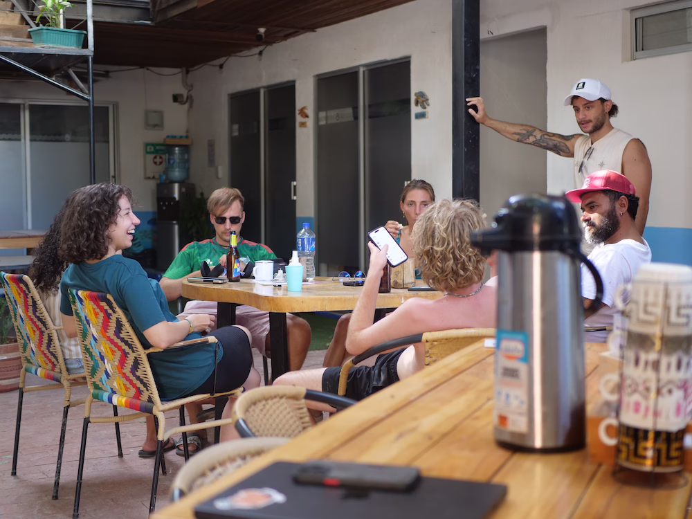 People socialising at the hostel, briefing after diving