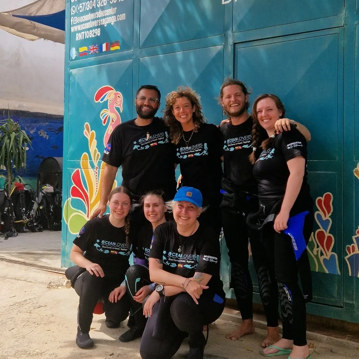 Group photo of seven Divemaster Trainees (DMT) completing their course with Ocean Lovers